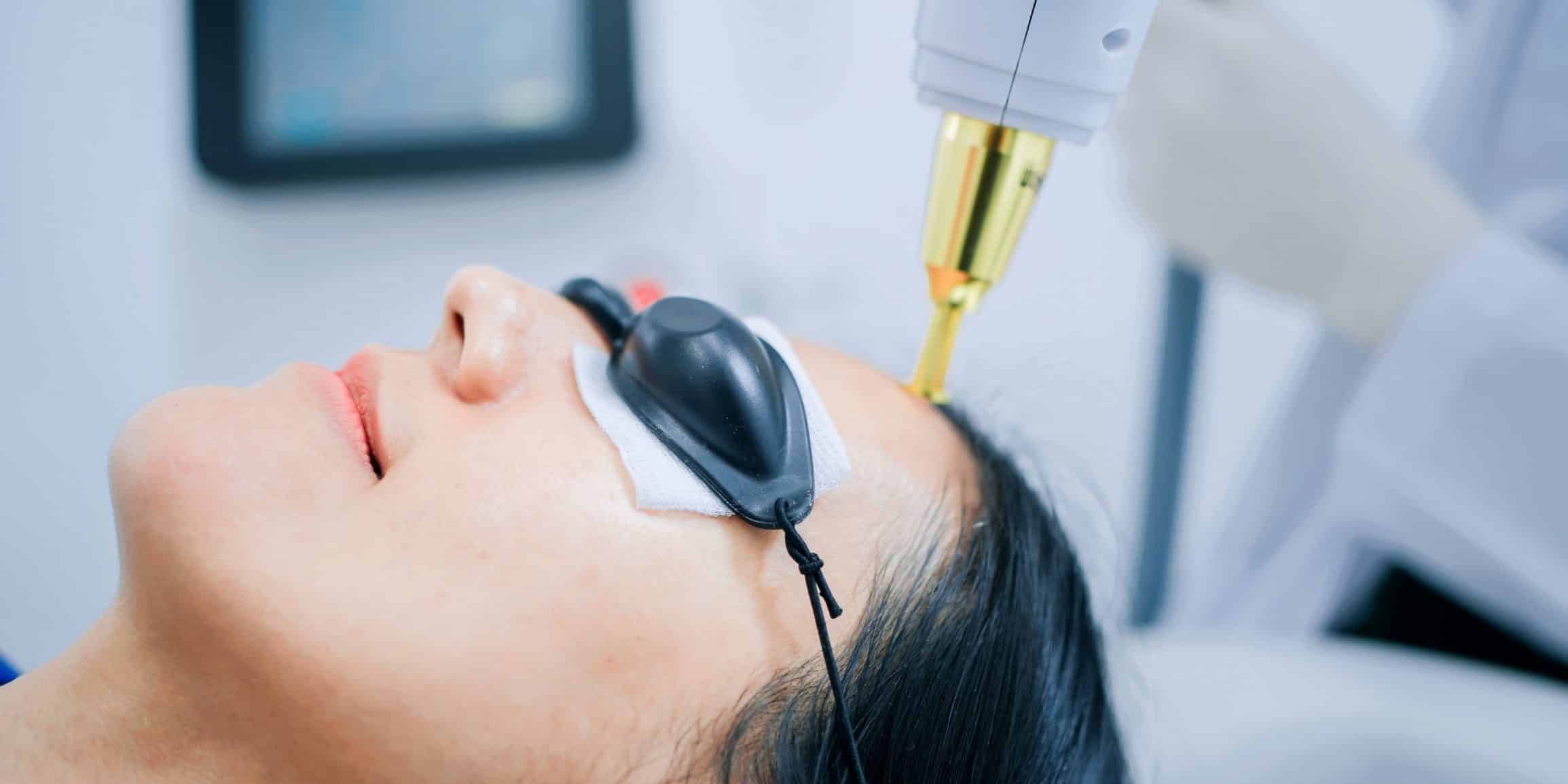 Anti-aging laser treatment session in modern dermatology clinic